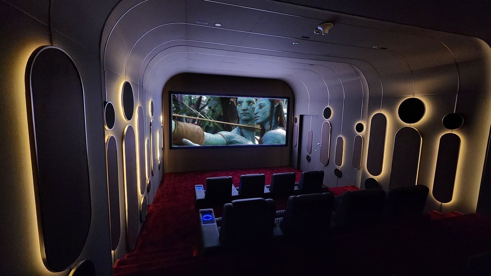 Fabric-wrapped acoustic wall panelling in a home cinema, Dubai Hills